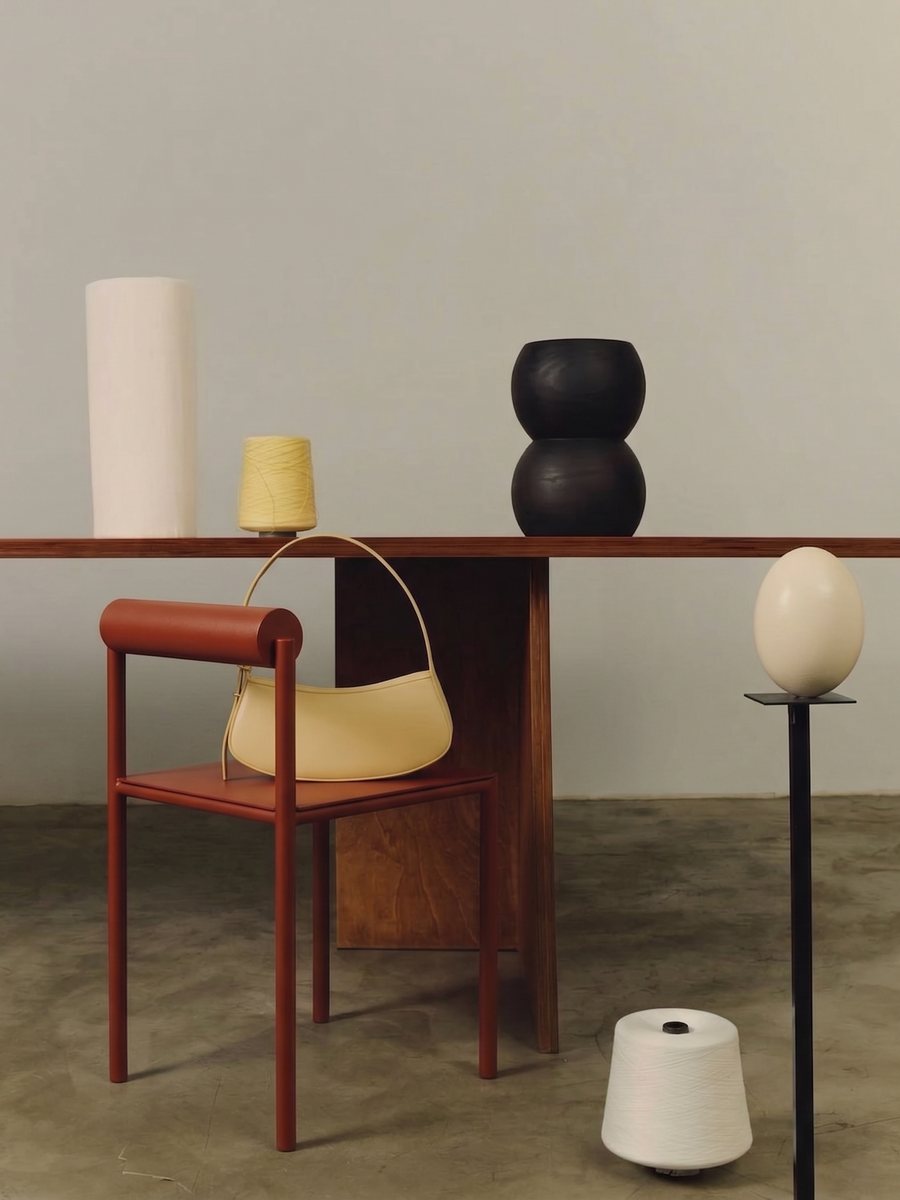 Interior product visual: red chair at a wooden table